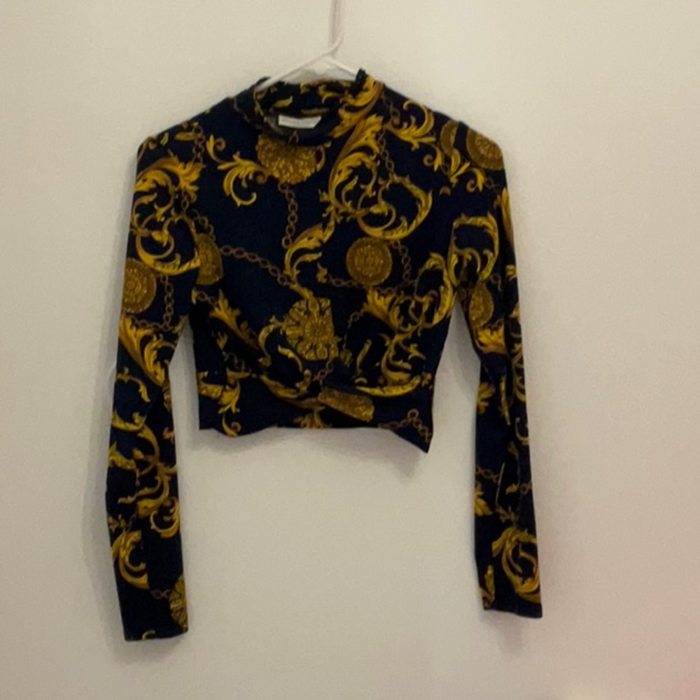 A dark blue crop top with gold chains for women